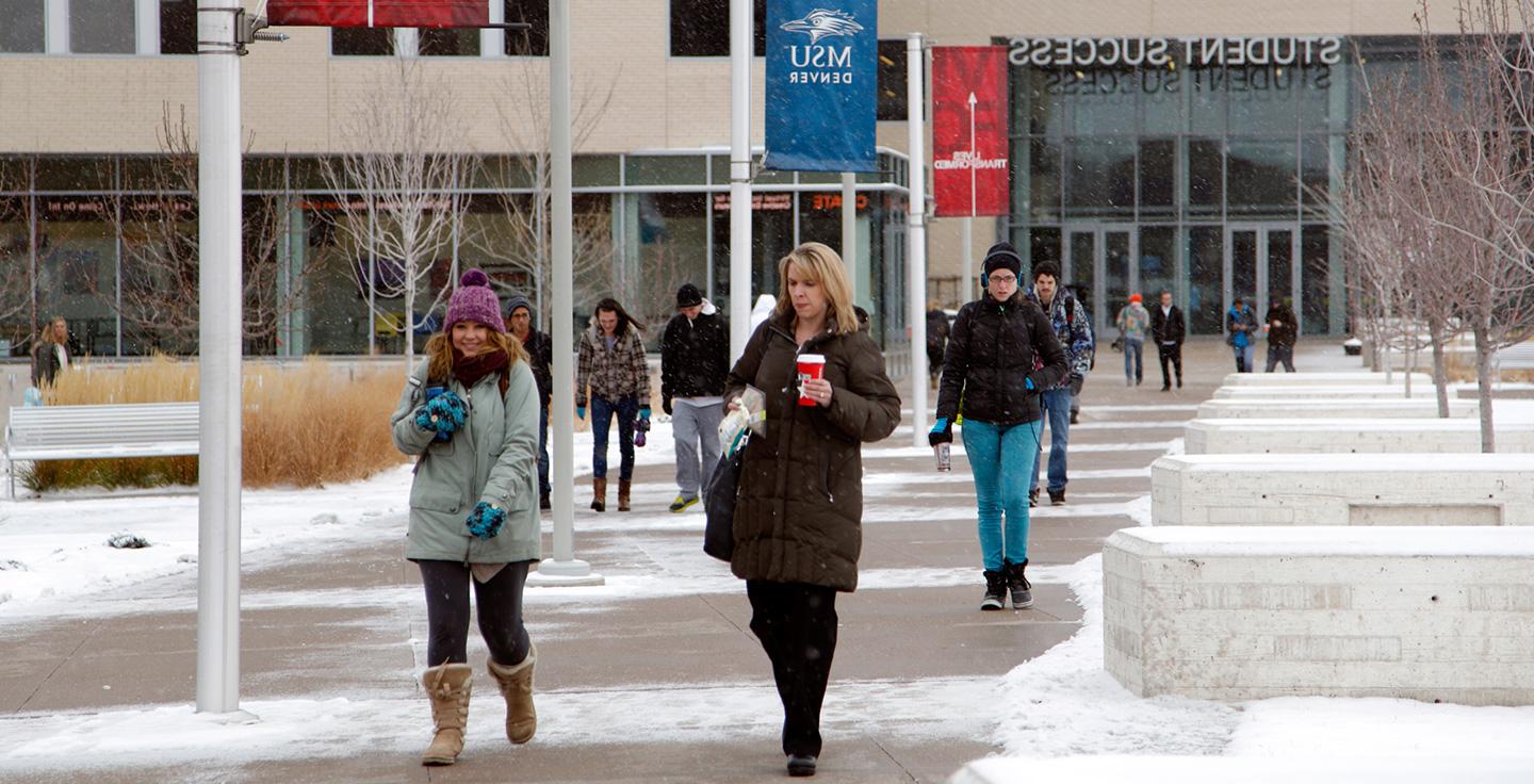 Students walking through Auraria Campus during the winter.