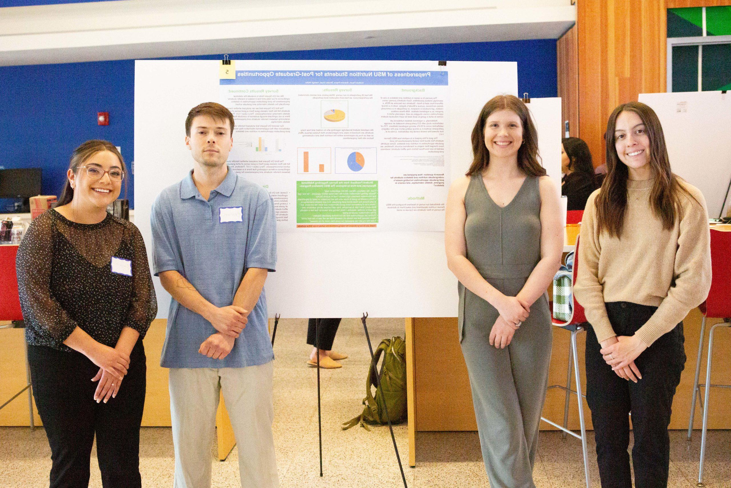 Students presenting at a conference